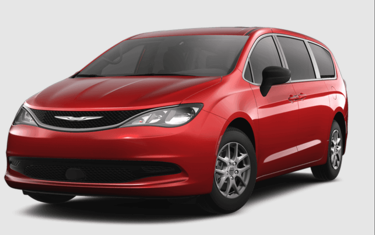 Manufacturer image of the base vehicle before conversion: a Chrysler Grand Caravan SXT in Red Hot Pearl, front three-quarter view, with no ramp or lowered floor fitted